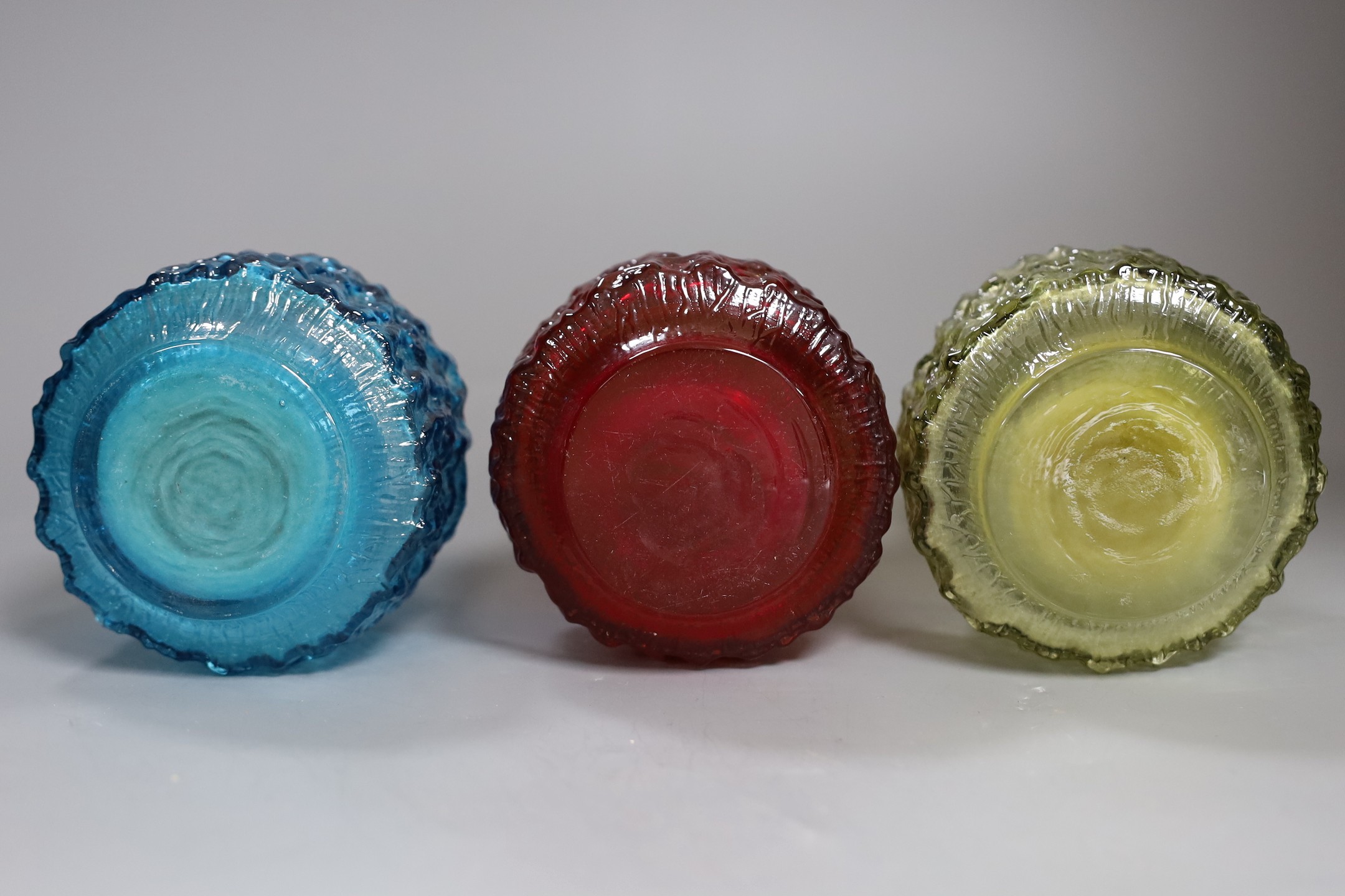 Three Whitefriars cylindrical bottle vases, in red, kingfisher blue and sage green glass (3) each 18cm high.